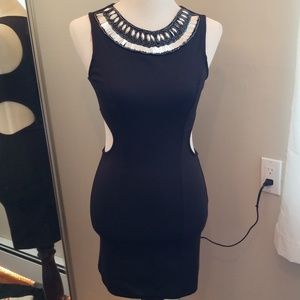 Black fitted dress with necklace open on side